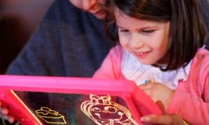 Girl with Light Up Kids Drawing Board